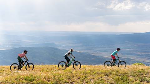 Three mountain bikers on Steamboat Resort