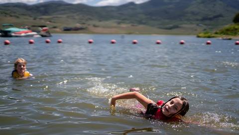 Kids swimming at Steamboat Resort's Mountain Camp.