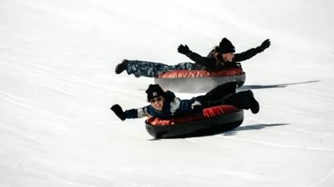 Snow tubing at Saddleback Ranch.