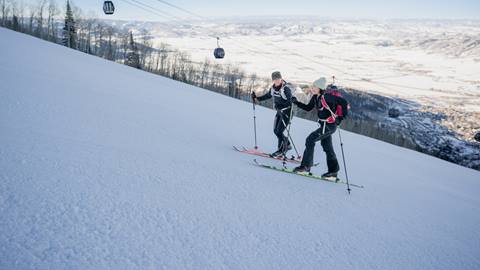Two women uphill touring at Steamboat Resort.