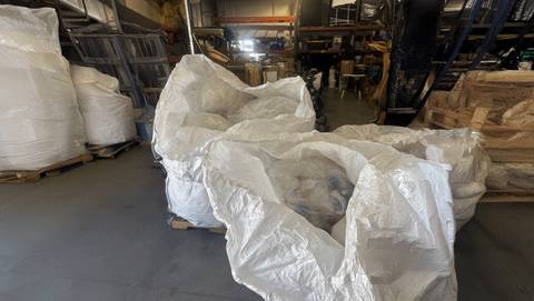 Large bags of raw plastic film.