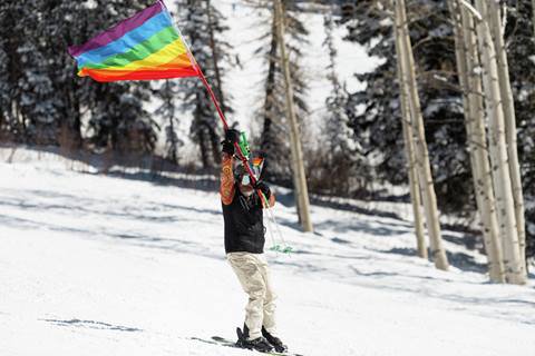 Skier with pride flag - Steamboat Rainbow Run 2026