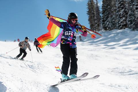 Flying Rainbow Run Skier with Pride Flag