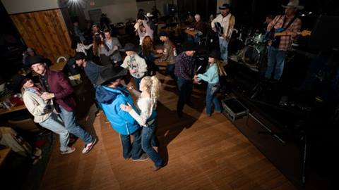 People dancing to western line dancing