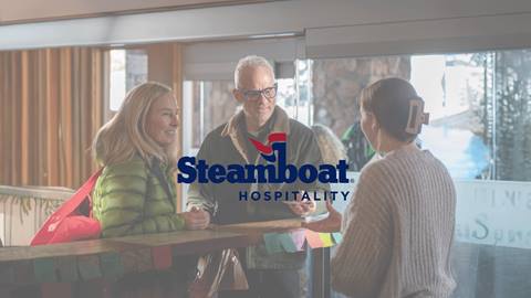A couple checking into a hotel in Steamboat.