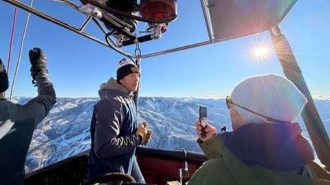 Meteorologist reporting from a hot air balloon in Steamboat Springs, CO.