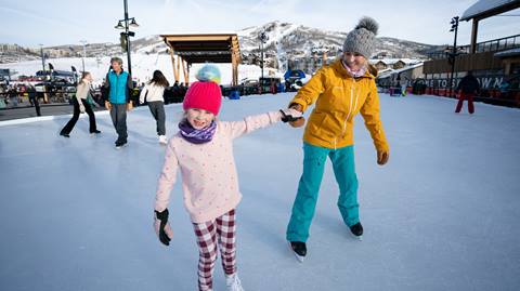 Mother and daughter ice skating on Skeeter's Ice Rink at Steamboat Resort