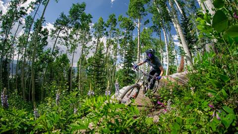 Mountain biker riding through Steamboat Bike Park.