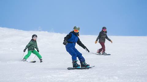 Family of three enjoying the slopes at Steamboat