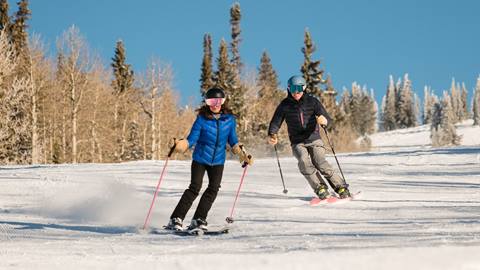 A couple skiing at Steamboat.