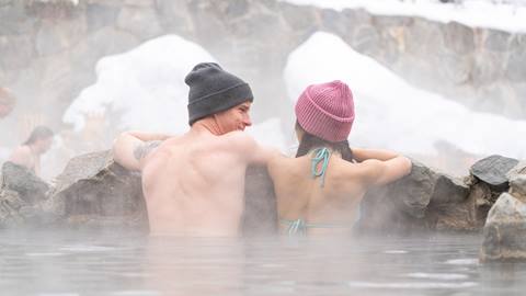 A couple enjoying Strawberry Park Hot Springs.