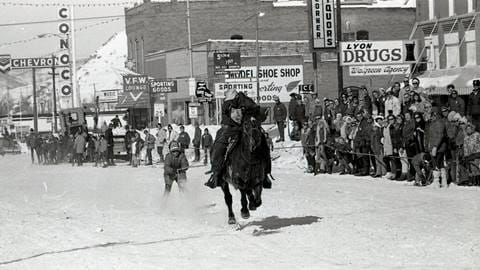 horse pulling skier